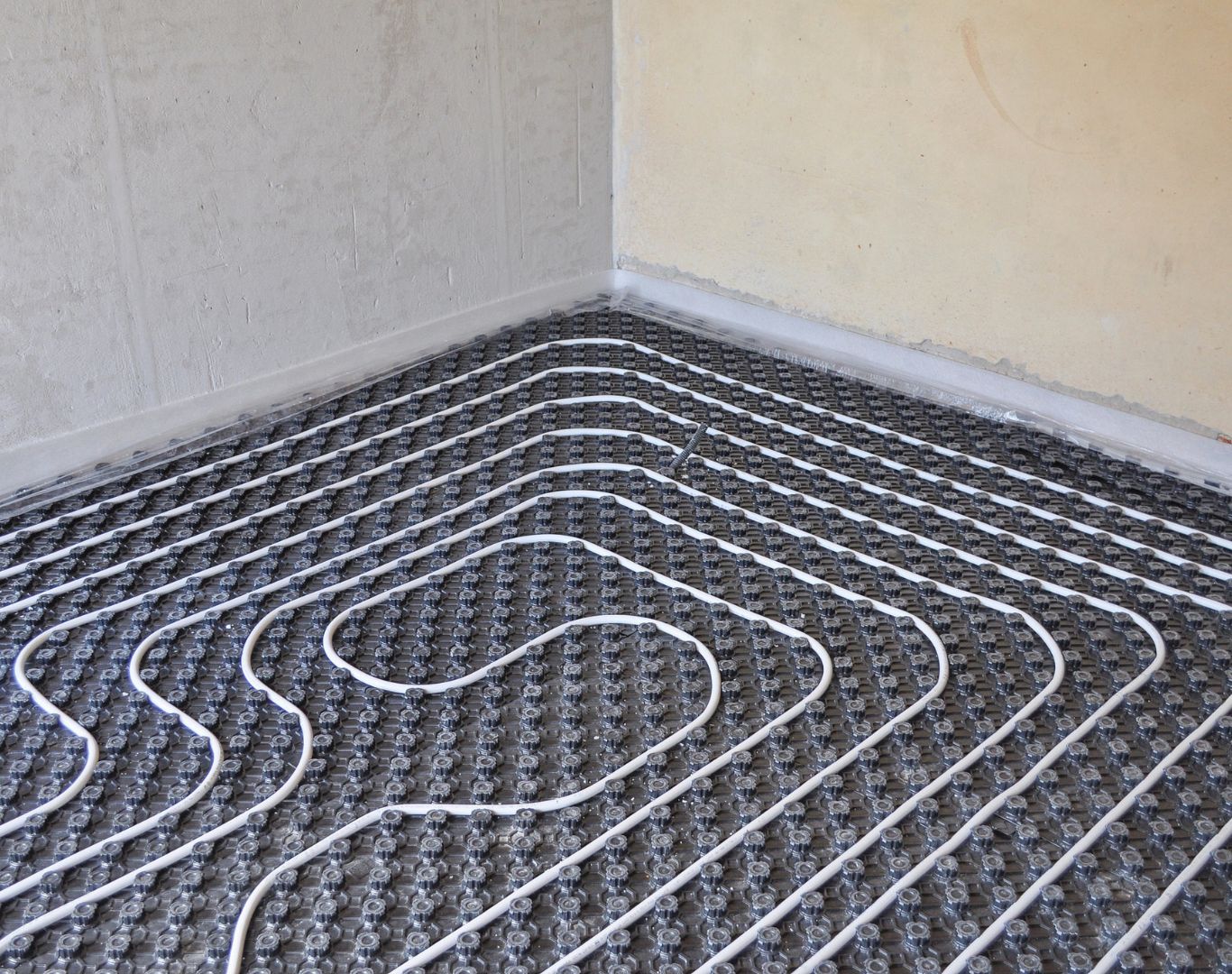 Geothermal Heating and Cooling in Lindenwold - NJ being connected as a technician checks indoor unit piping
